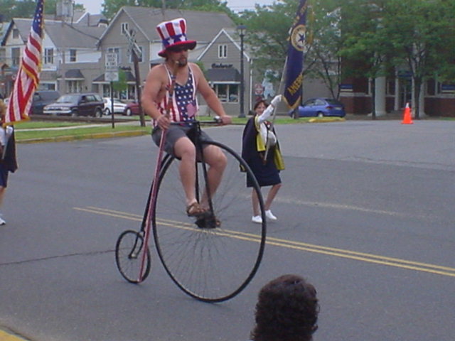 A Patriotic Man on an Old-Fashioned Bike