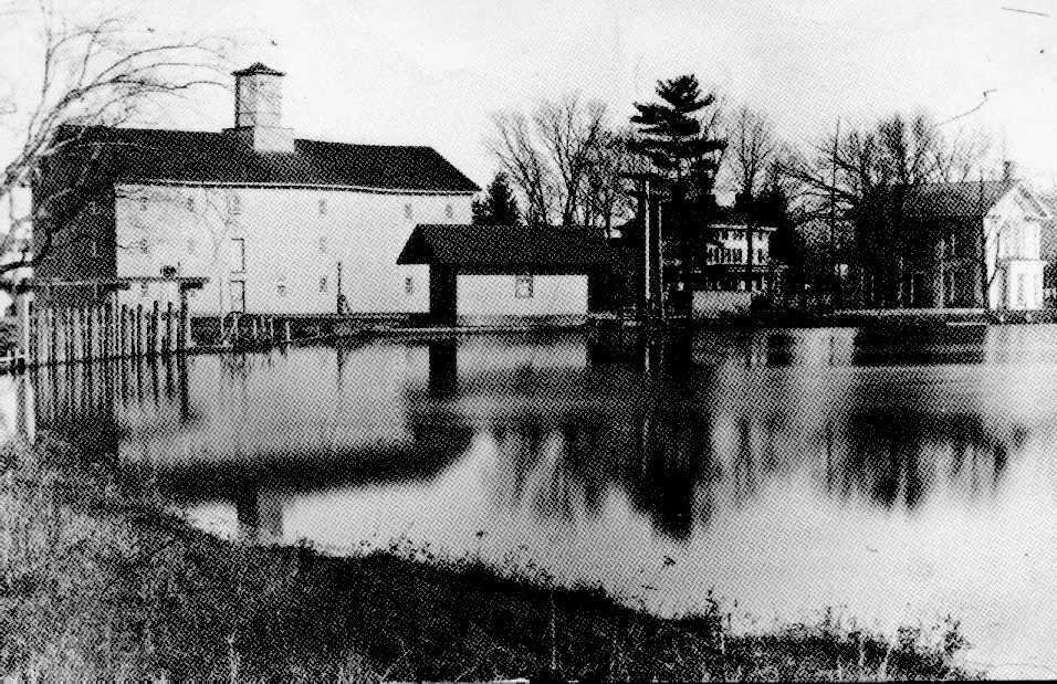 A tranquil scene in Jamesburg, NJ in the late 1800's.  
Behind Lake Manalapan, the Grist Mill, Lower Jamesburg Station, Lakeview, - home of James Buckelew, and the First National Bank of Jamesburg - 1864.