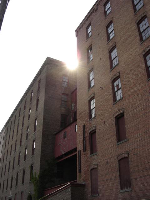 The sun sets over the snuff mill.